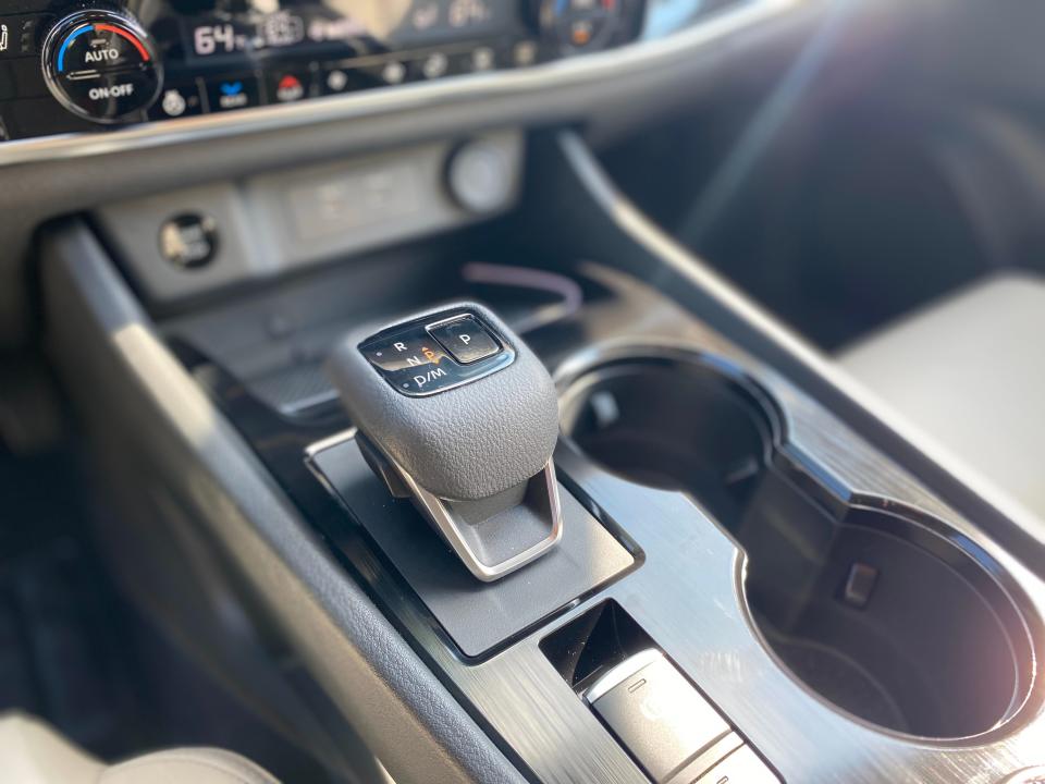 The great shifter on the center console of a 2024 Nissan Rogue SL SUV.