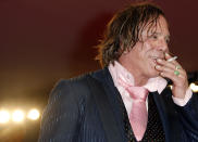 U.S. actor Mickey Rourke smokes a cigarette during a red carpet event at the Venice Film Festival September 5, 2008. Rourke stars in the movie "The Wrestler" by director Darren Aronofsky which is being shown in the competition at the Venice Film Festival. REUTERS/Denis Balibouse (ITALY)