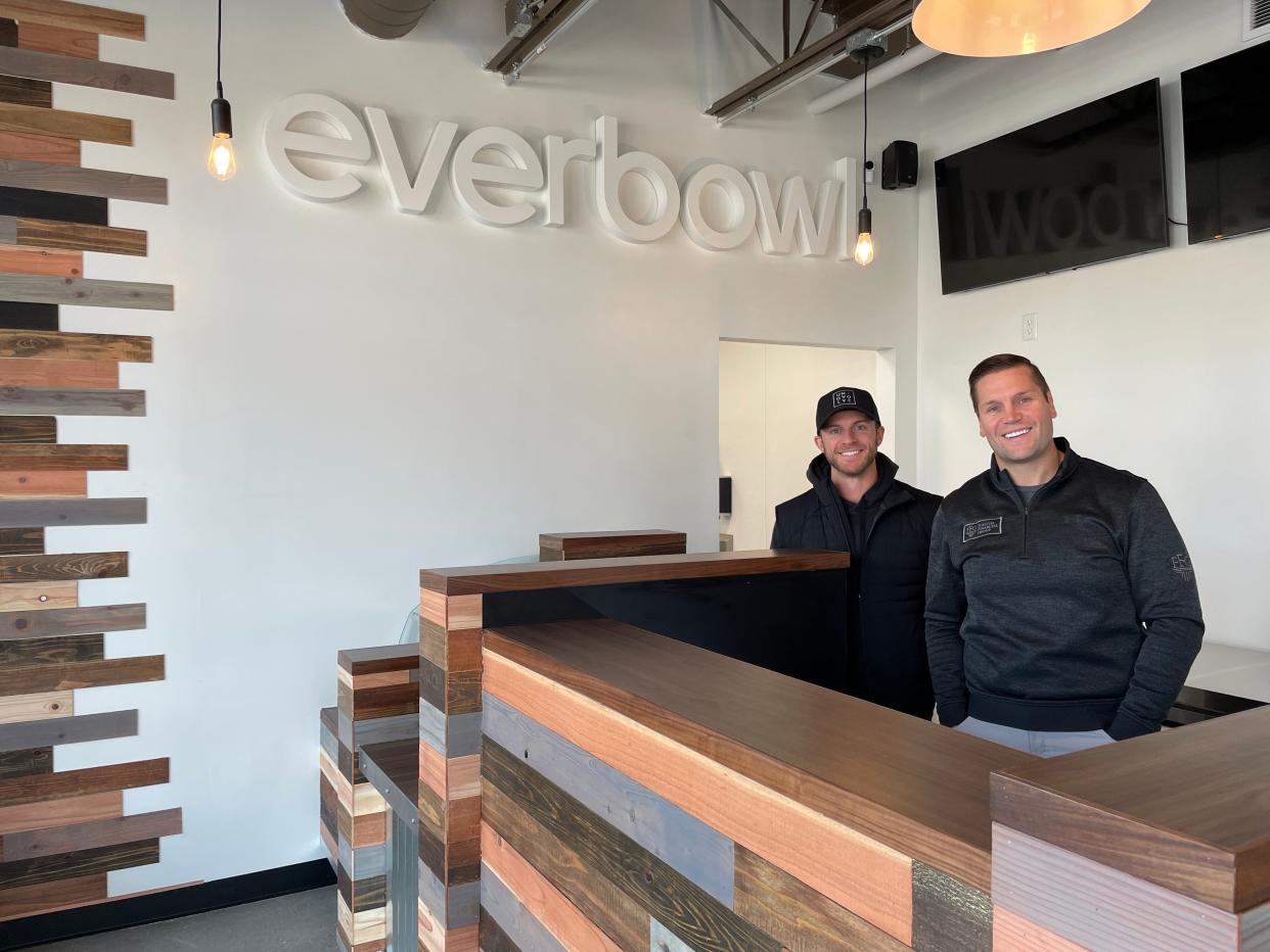 Chris Triplett (left) and Michael Foguth prepare to open Michigan's first Everbowl franchise in downtown Brighton on Tuesday, Oct. 31, 2023.