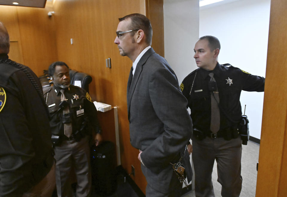 Oakland County Sheriff officers bring James Crumbley into the Oakland County Courtroom on Monday, March 11, 2024, in Pontiac, Mich. Crumbley is on trial for involuntary manslaughter in his 15-year-old son's killing of four students at Oxford High School. (Daniel Mears/Detroit News via AP, Pool)