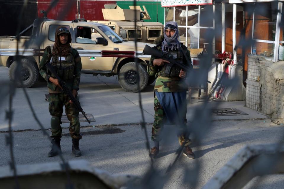 Taliban fighters stand guard at a checkpoint (Wali Sabawoon/AP) (AP)