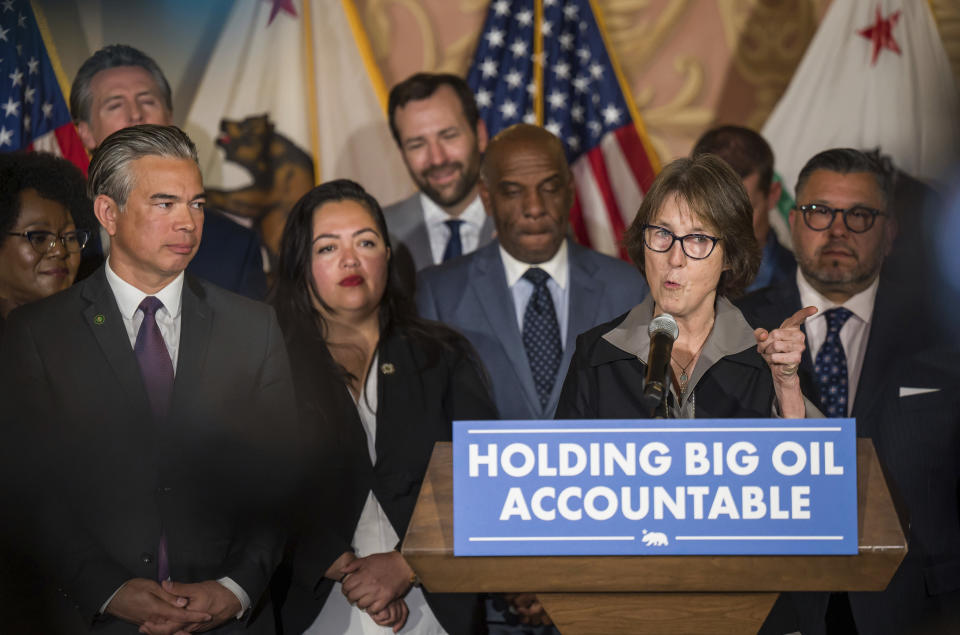 Sen. Nancy Skinner, D-Berkeley, speaks before Gov. Gavin Newsom signs a bill she authored aimed at addressing gas price gouging, at the Capitol, Tuesday, March 28, 2023, in Sacramento, Calif. (Xavier Mascareñas/The Sacramento Bee via AP)