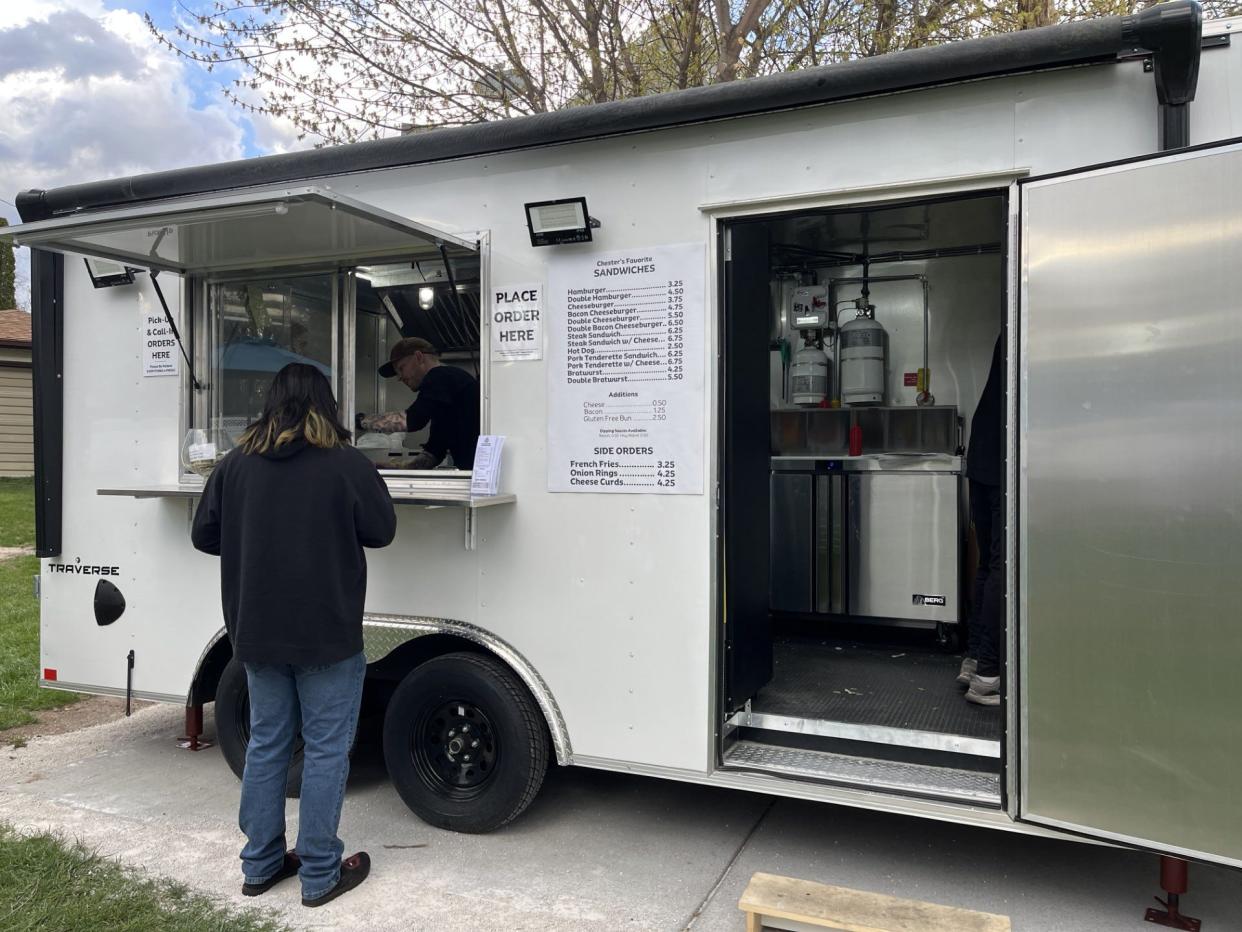 A customer orders from Chester's Drive-In trailer near Sheboygan's lakefront during the soft opening, as seen Tuesday in Sheboygan.