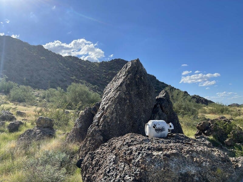 A propane tank used for target shooting mars the landscape of the Sonoran Desert National Monument.