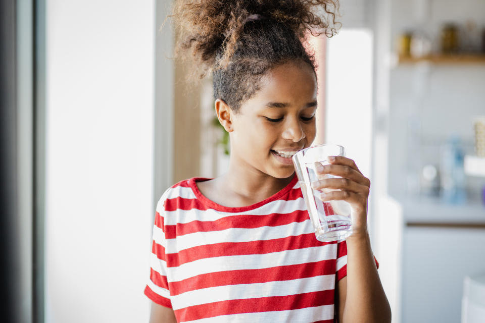 Young girl drinking water