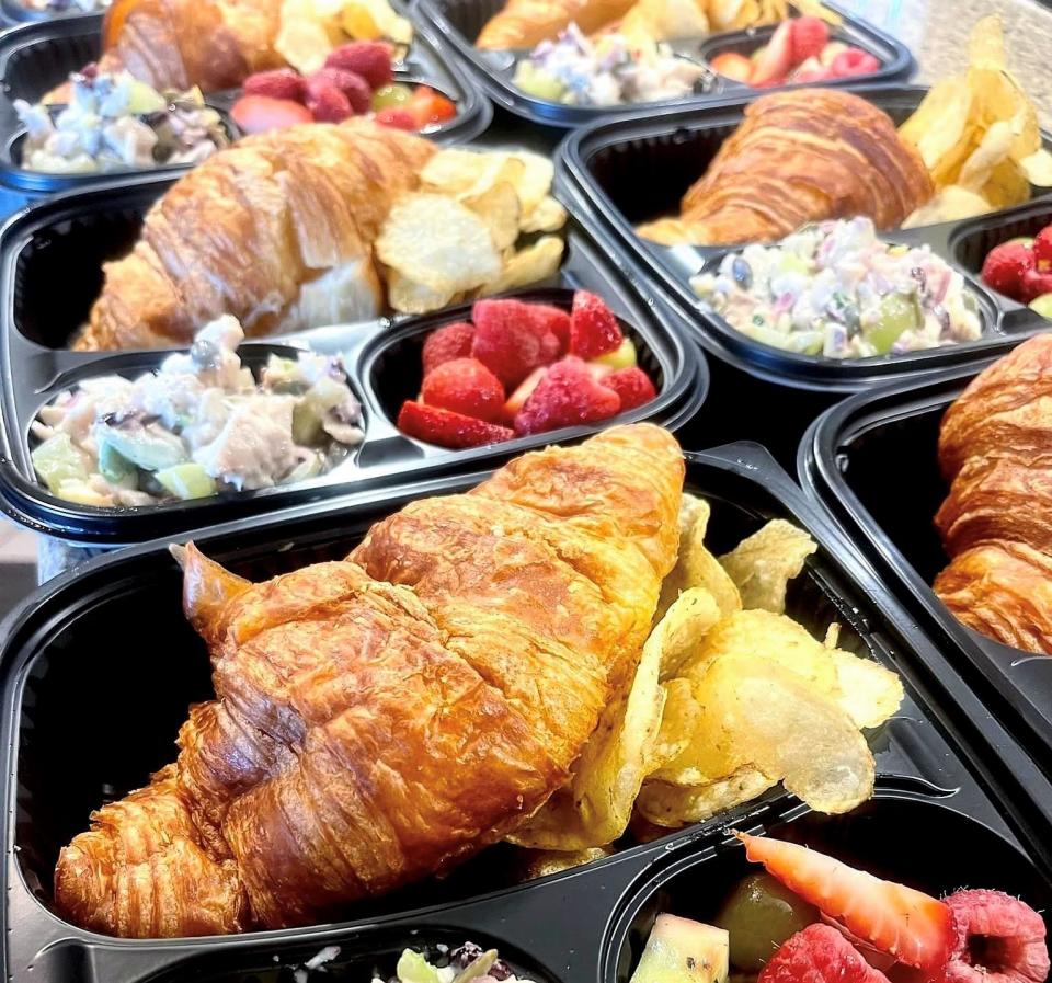 Box lunches recently provided by To the Table catering included fruity chicken salad, croissants, chips and fruit salad.