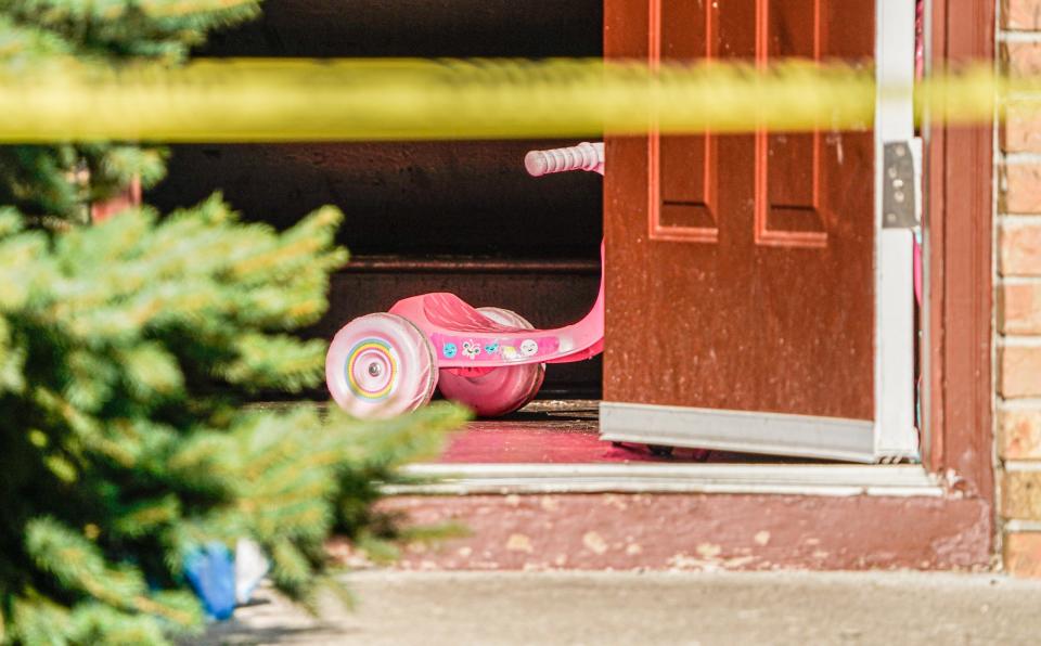A child's tricycle sits just inside the door as Cumberland Police investigate after a 4-year-old child died Wednesday afternoon after being shot by another child in the home on Wednesday, July 5, 2023, in the 600 block of Woodlark Drive in Cumberland Ind.