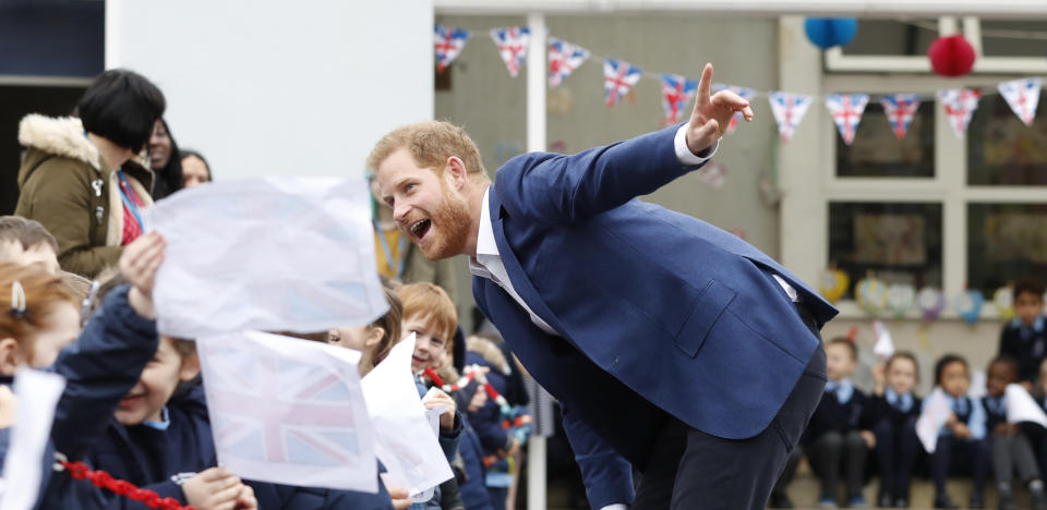 Harry was just a big kid on the trip to the London school. Photo: Getty Images