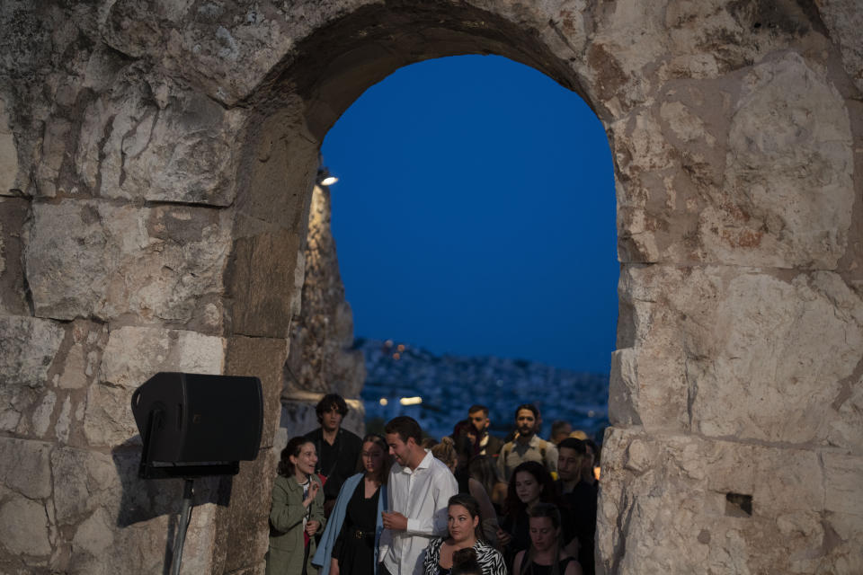 Spectators enter the Odeon of Herodes Atticus for a performance of "Madame Butterfly" in Athens, on Thursday, June 1, 2023. The annual arts festival in Athens and at the ancient theater of Epidaurus in southern Greece is dedicated this year to the late opera great Maria Callas who was born 100 years ago. (AP Photo/Petros Giannakouris)