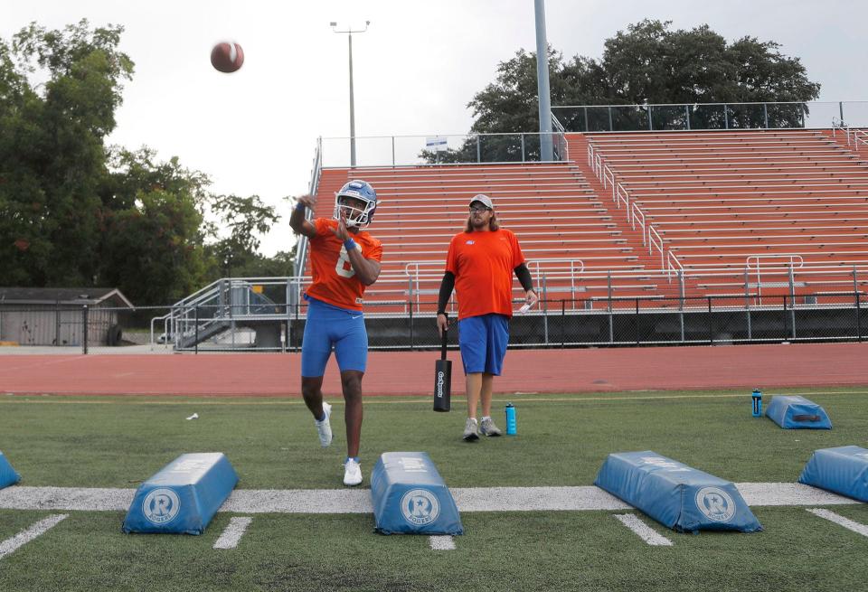 Savannah State quarterback Jamaurion "JT" Hartage passes the ball as he runs through a drill during practice at TA Wright Stadium.