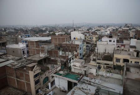 General view of a neighbourhood next to the abandoned former Union Carbide pesticide plant in Bhopal November 15, 2014. REUTERS/Danish Siddiqui