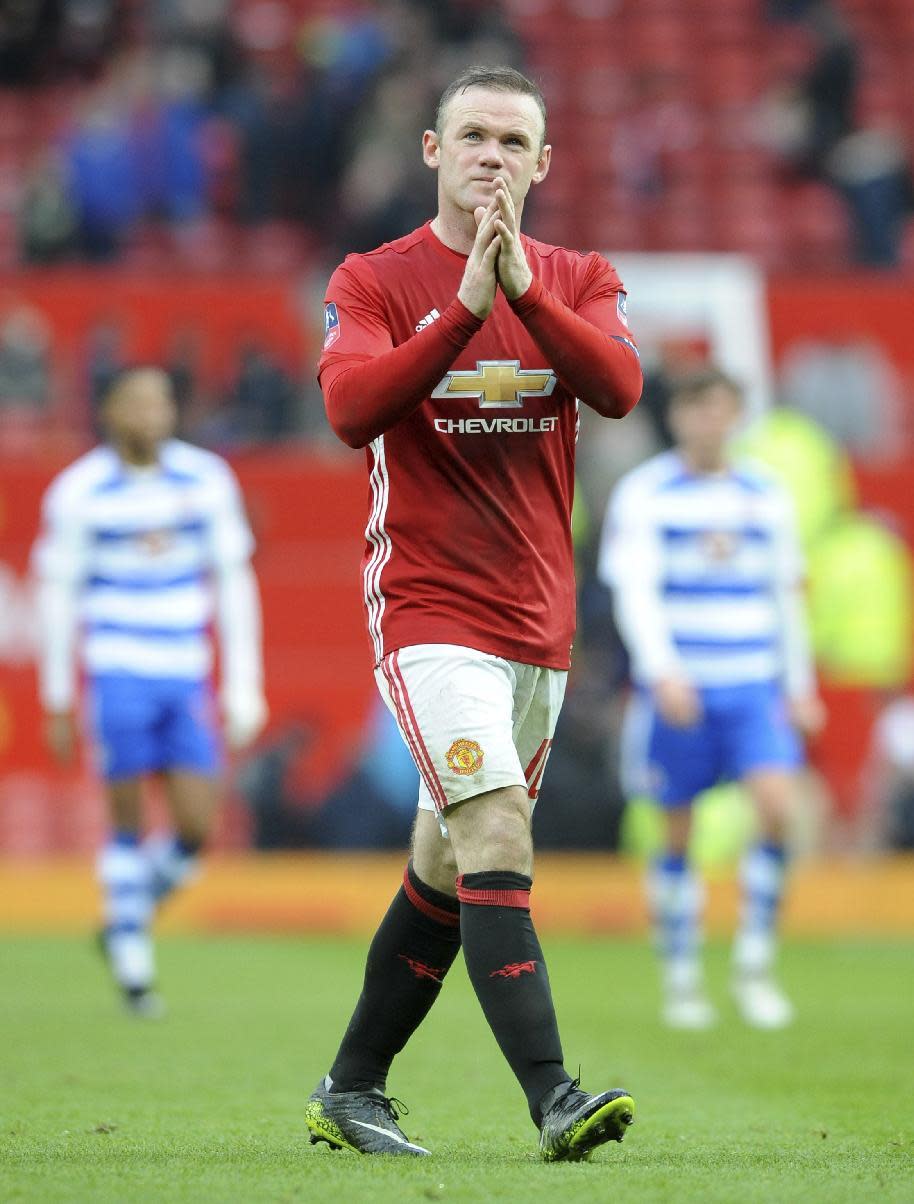 Manchester United's Wayne Rooney applauds the fans as he walks from the pitch after the end of the English FA Cup Third Round match between Manchester United and Reading at Old Trafford in Manchester, England, Saturday, Jan. 7, 2017. United won the match 4-0. (AP Photo/Rui Vieira)