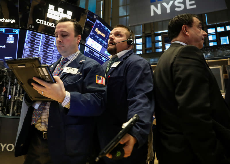 Traders work on the floor of the New York Stock Exchange (NYSE) in New York, U.S., December 18, 2018. REUTERS/Brendan McDermid