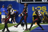 Atlanta Falcons cornerback Darren Hall, center, reacts after recovering a fumble during the second half of an NFL football game against the Los Angeles Rams, Sunday, Sept. 18, 2022, in Inglewood, Calif. (AP Photo/Ashley Landis)