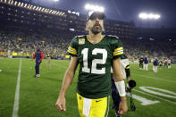 Green Bay Packers quarterback Aaron Rodgers walks off the field after an NFL football game against the New England Patriots, Sunday, Oct. 2, 2022, in Green Bay, Wis. The Packers won 27-24 in overtime. (AP Photo/Matt Ludtke)