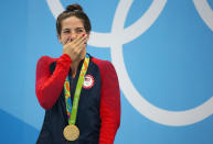 <p>Maya DiRado of USA poses with her gold medal for the women’s 200m backstroke at the Aquatics Stadium in Rio on August 12, 2016. (REUTERS/Michael Dalder) </p>
