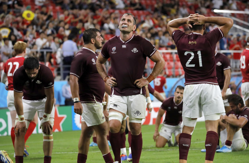 Georgia players react after Wales George North scored a try during the Rugby World Cup Pool D game between Wales and Georgia at Toyota City Stadium, Toyota City, Japan, Monday, Sept. 23, 2019. (AP Photo/Christophe Ena)