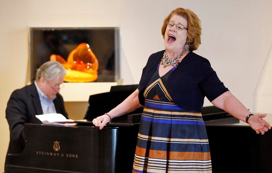 Soprano Barbara DeMaio performs while accompanied by Jan McDaniel on piano during a performance by Painted Sky Opera at the Oklahoma City Museum of Art in Oklahoma City, Wednesday, July 26, 2017.