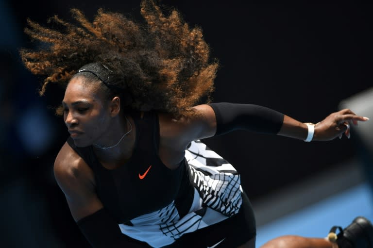 Serena Williams serves against Belinda Bencic during their Australian Open first round match in Melbourne on January 17, 2017