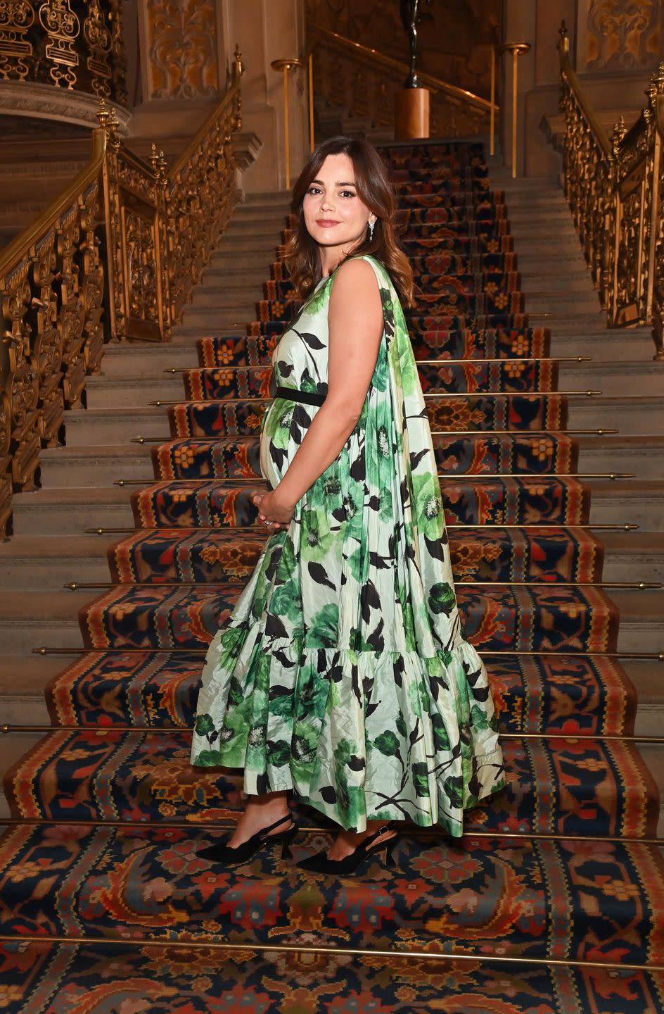 jenna coleman cradling her baby bump