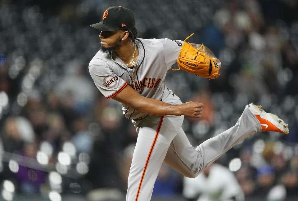 San Francisco Giants relief pitcher Camilo Doval works against the Colorado Rockies in the ninth inning of a baseball game Tuesday, May 7, 2024, in Denver. (AP Photo/David Zalubowski)