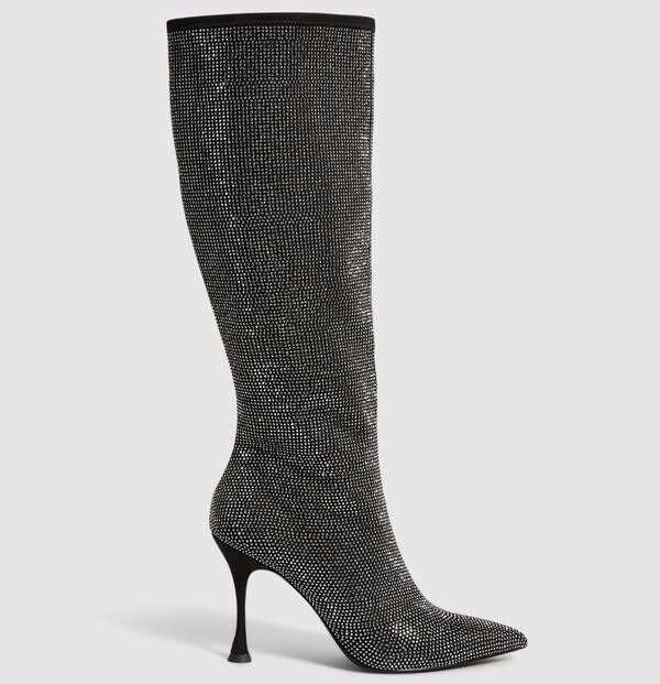 She finished off her look with a pair of knee-high sparkly boots from Reiss. (Reiss)
