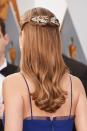 <p>An embellished hair accessory adds a festive touch to any style.</p>