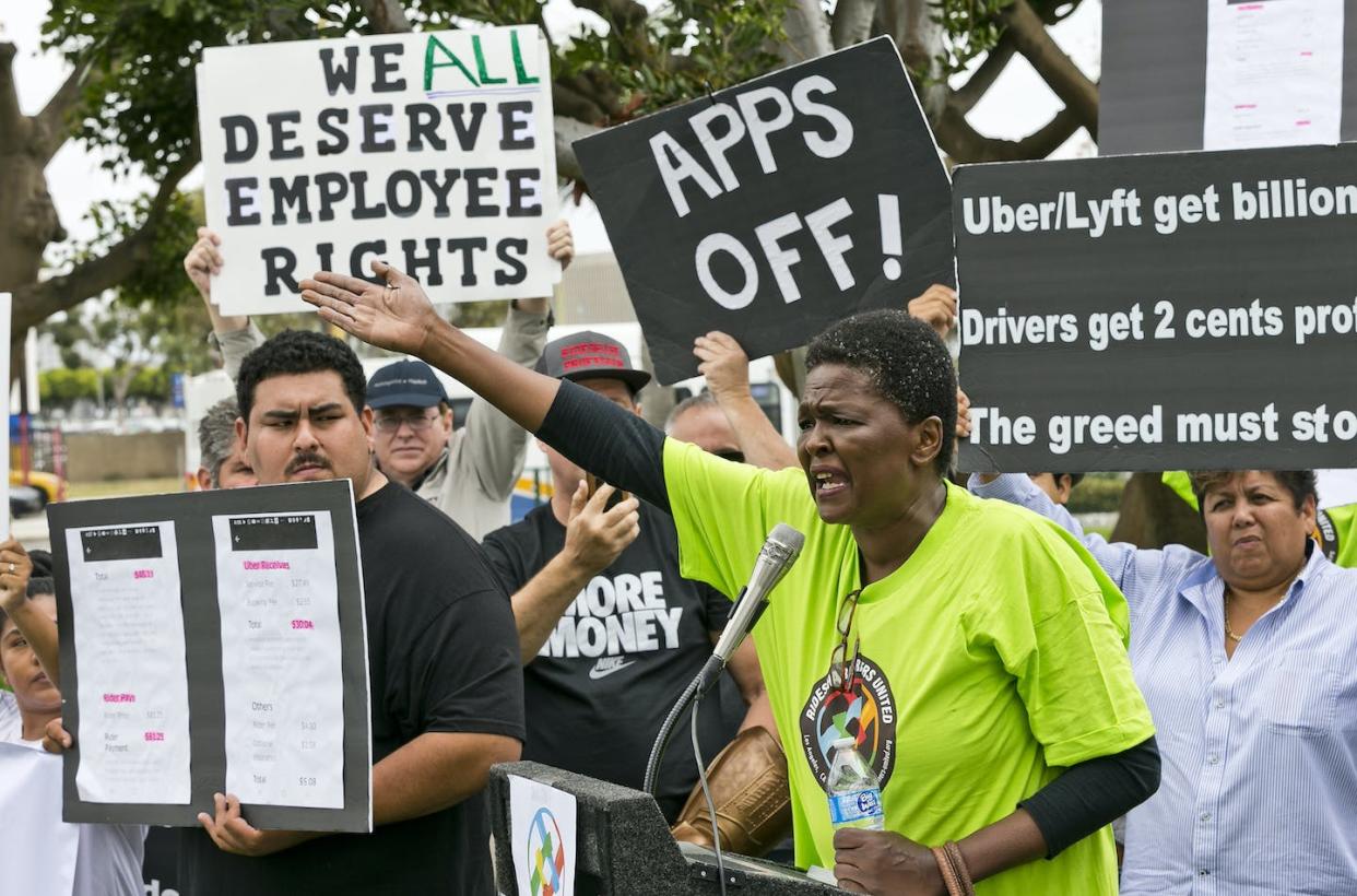 Uber and Lyft drivers protest their working conditions in Los Angeles in May 2019. <a href="http://www.apimages.com/metadata/Index/Uber-Lyft-Strike/f52489c0915342989cd1e693e51ad748/21/0" rel="nofollow noopener" target="_blank" data-ylk="slk:AP Photo/Damian Dovarganes;elm:context_link;itc:0;sec:content-canvas" class="link ">AP Photo/Damian Dovarganes</a>