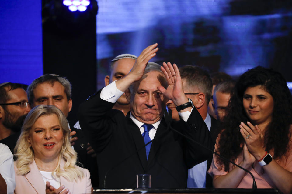 Israeli Prime Minister Benjamin Netanyahu addressees his supporters at party headquarters after elections in Tel Aviv, Israel, Wednesday, Sept. 18, 2019. (AP Photo/Ariel Schalit)