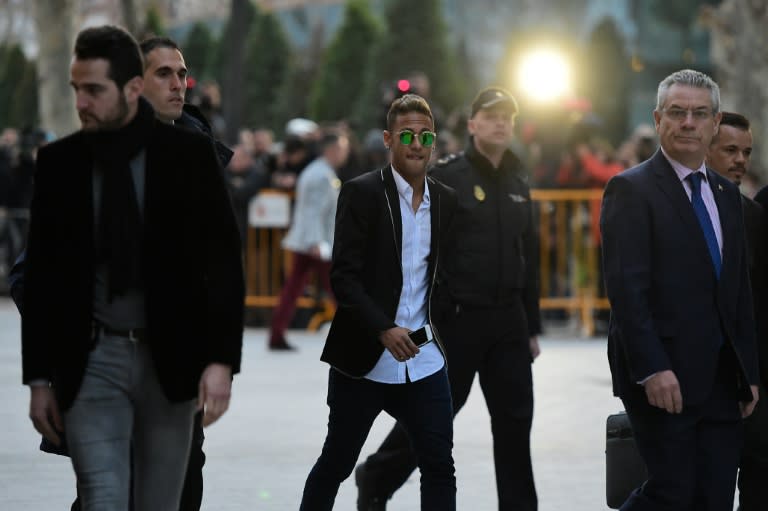 Barcelona's Brazilian forward Neymar (C) leaves Spain's national court in Madrid on February 2, 2016