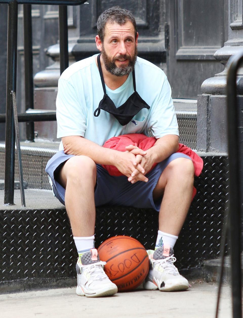 <p>Adam Sandler takes a breather after playing basketball in downtown N.Y.C. on Sunday.</p>