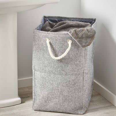 A laundry basket with handles for easy carrying