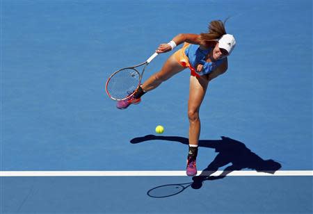 Johanna Larsson of Sweden serves to Victoria Azarenka of Belarus during their women's singles match at the Australian Open 2014 tennis tournament in Melbourne January 14, 2014. REUTERS/Petar Kujundzic