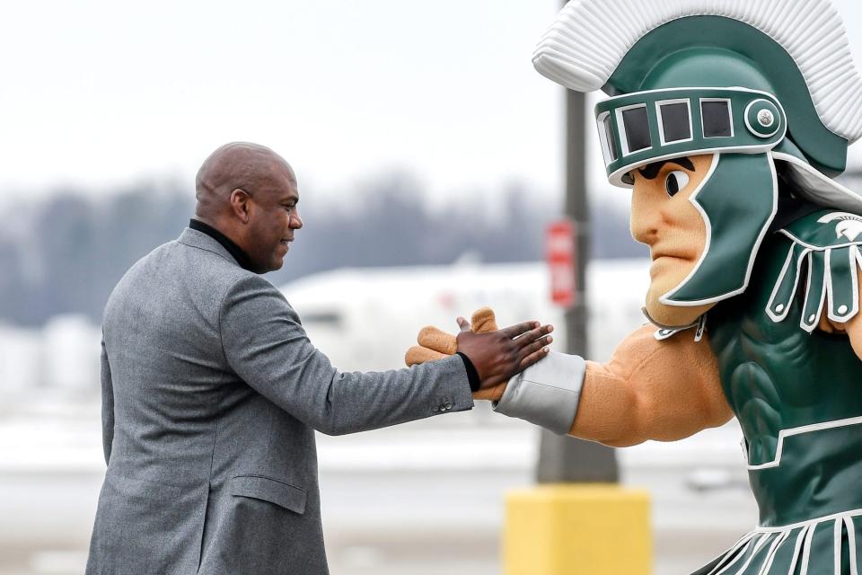 Sparty, right, will not be inside Spartan Stadium on Saturday for the Michigan State football debut of new coach Mel Tucker, left.