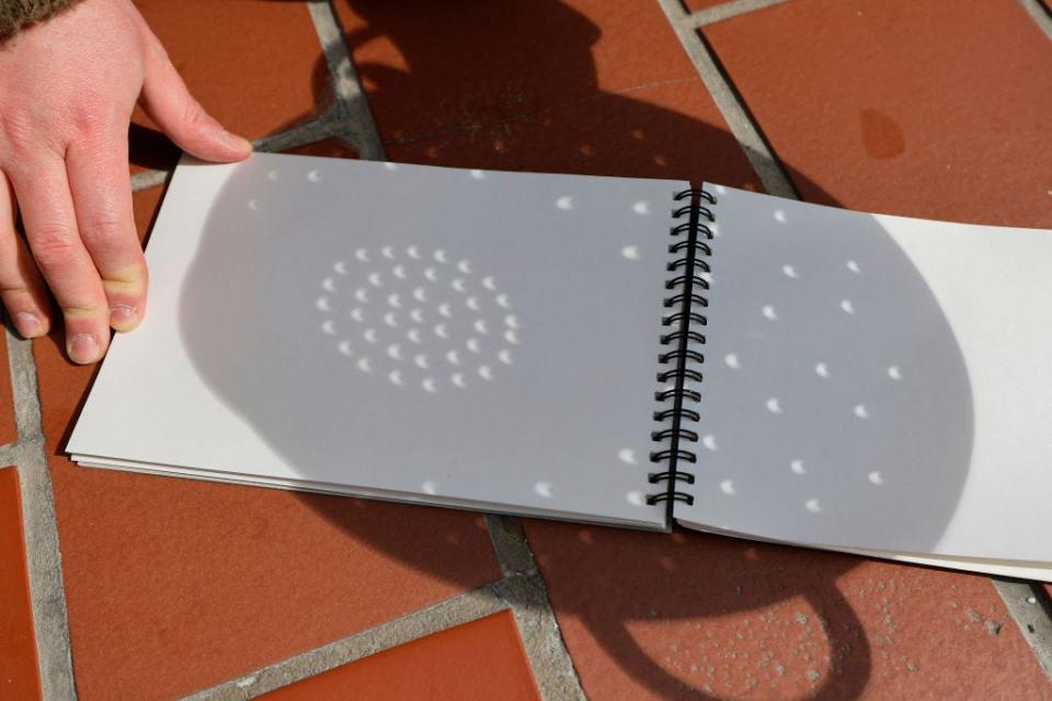 Solar eclipse viewed through a colander