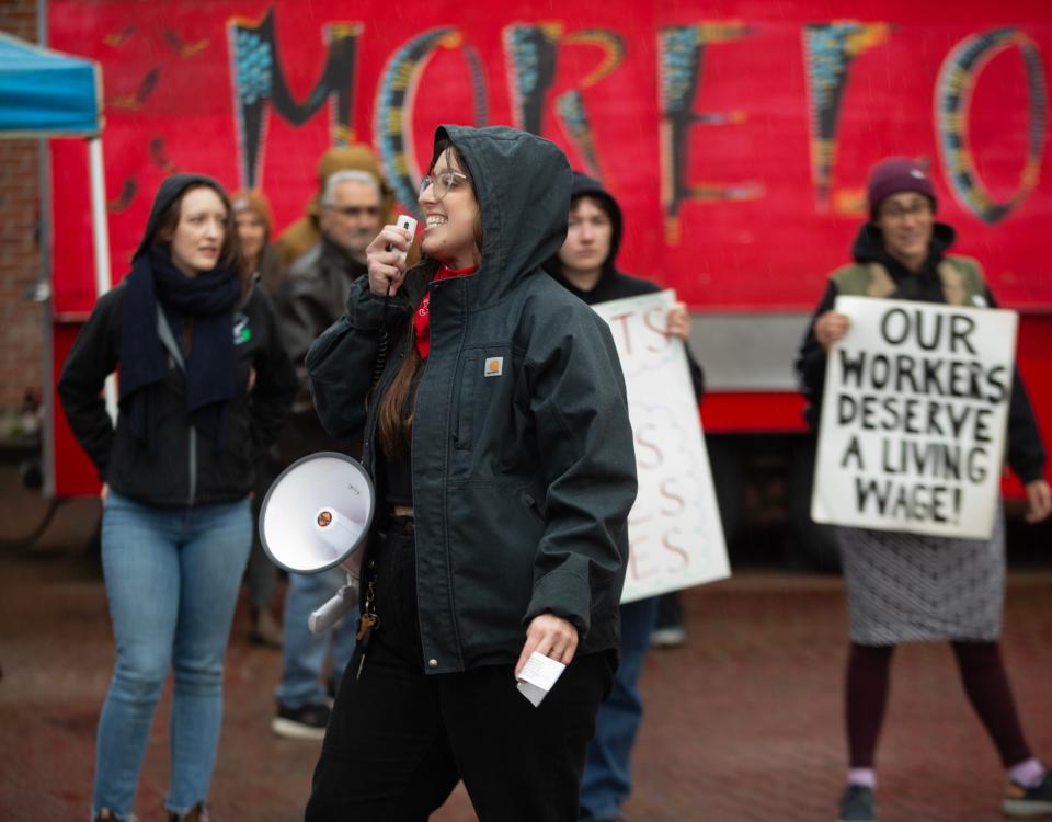 Chelsea Swift, center, joins CAHOOTS and HOOTS workers during a rally in support of their union in downtown Eugene Friday, April 5, 2024.