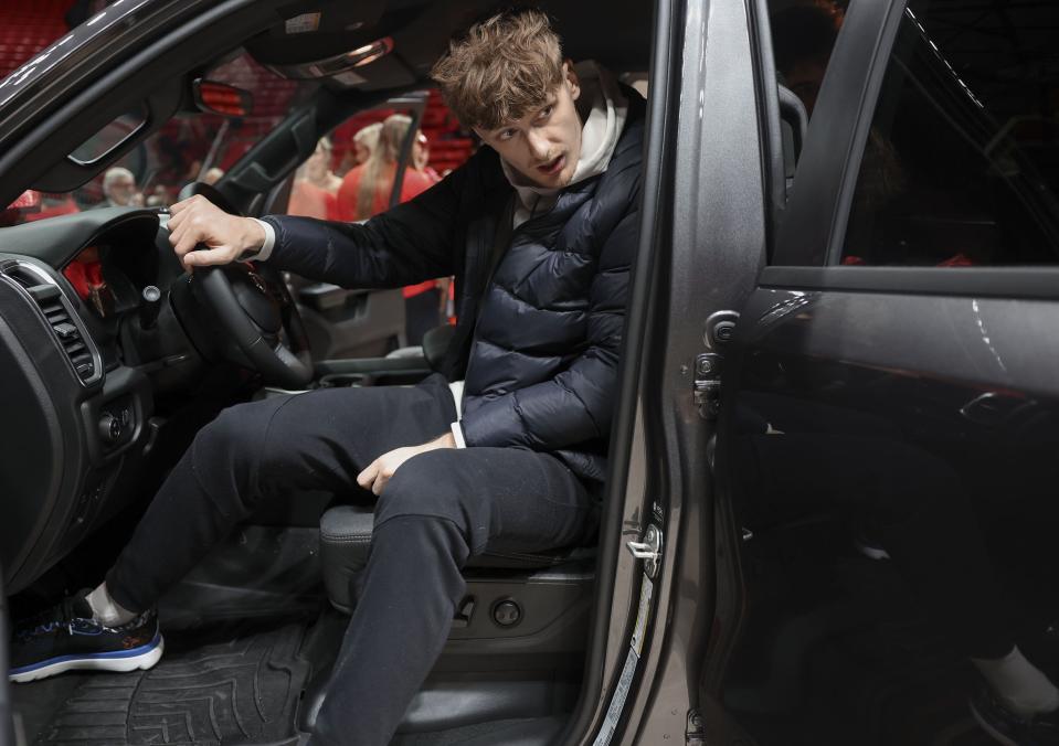 Utah men’s basketball player Cole Bajema steps out of a 2024 Jeep Grand Cherokee L Limited Edition at the Huntsman Center in Salt Lake City on Wednesday, Dec. 13, 2023. A vehicle lease deal was made available to members of the women’s gymnastics and men’s and women’s basketball programs as part of a Name, Image and Likeness (NIL) deal. | Laura Seitz, Deseret News