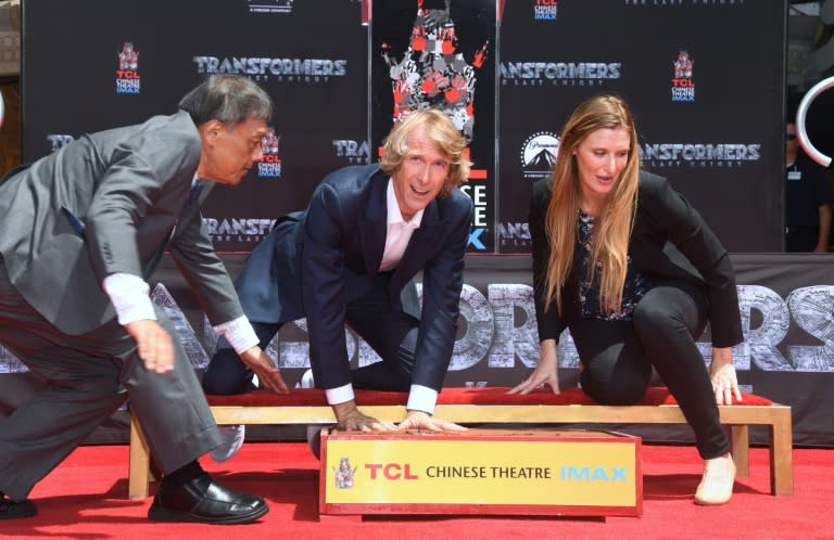 Filmmaker Michael Bay places his hands in a block of cement at a ceremony in front of the TCL Chinese Theater in Hollywood, California on May 23, 2017