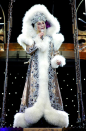 <p>Performing in 2004, Cher looked resplendent in this fur-trimmed cape. <i>[Photo: Rex]</i></p>