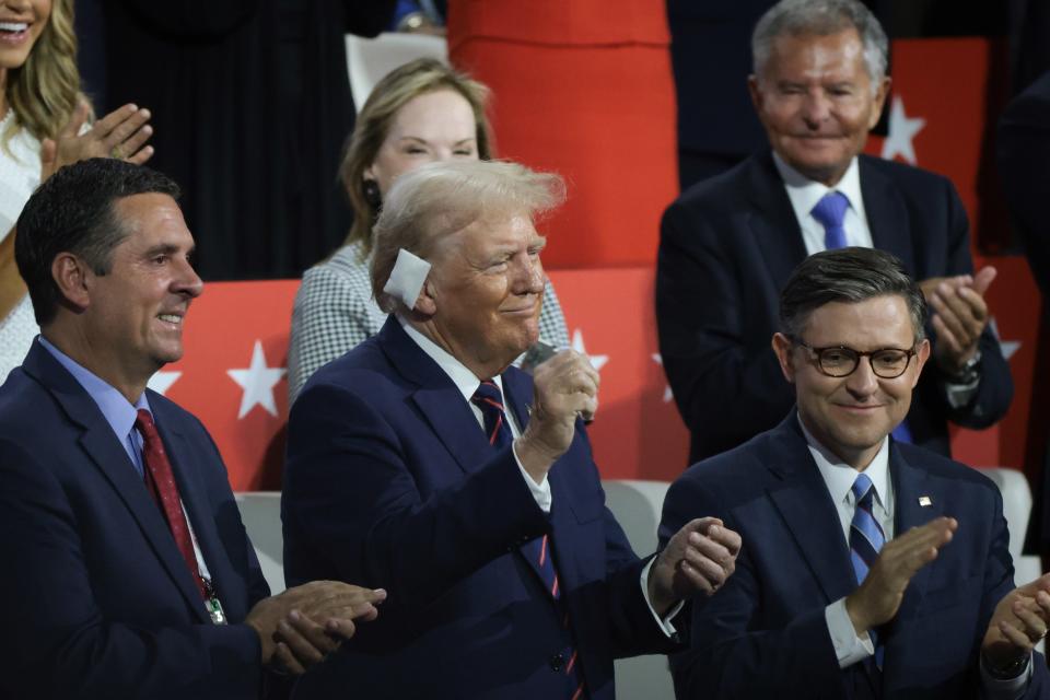 Former President Donald Trump and House Speaker Mike Johnson, right, at the Republican National Convention on July 17, 2024, in Milwaukee.