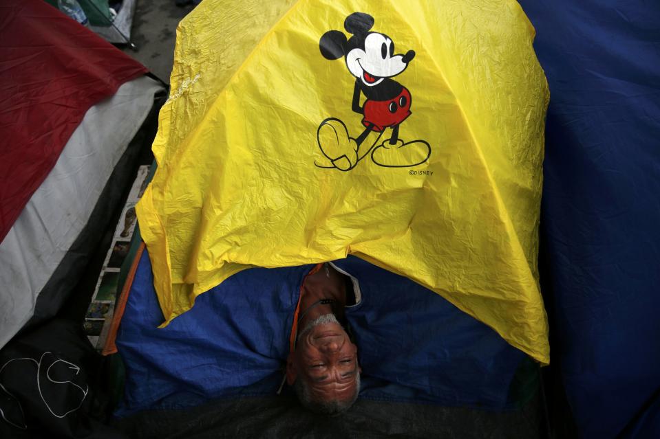 An Argentinian fan rests inside his tent amongst others at a tent and motorhomes park as they wait for Sunday's World Cup final match between Argentina and Germany at the Terreirao do Samba in Rio de Janeiro