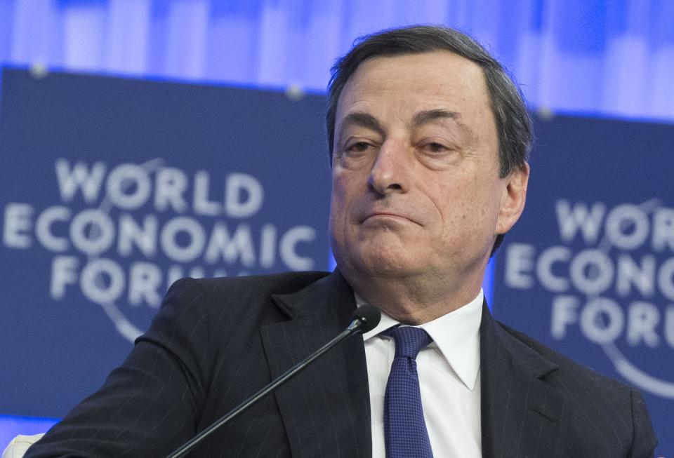 Mario Draghi, President of the European Central Bank, pauses as he speaks during a session at the World Economic Forum in Davos, Switzerland, Friday, Jan. 24, 2014. Leaders gathered in the Swiss ski resort of Davos have made it a top priority to push to reshape the global economy and cut global warming by shifting to cleaner energy sources. (AP Photo/Michel Euler)