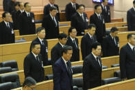 Parliament House members stand in silence to honor Thailand's King Bhumibol Adulyadej during an special session in Bangkok, Thailand October 13, 2016. Dailynews/via REUTERS