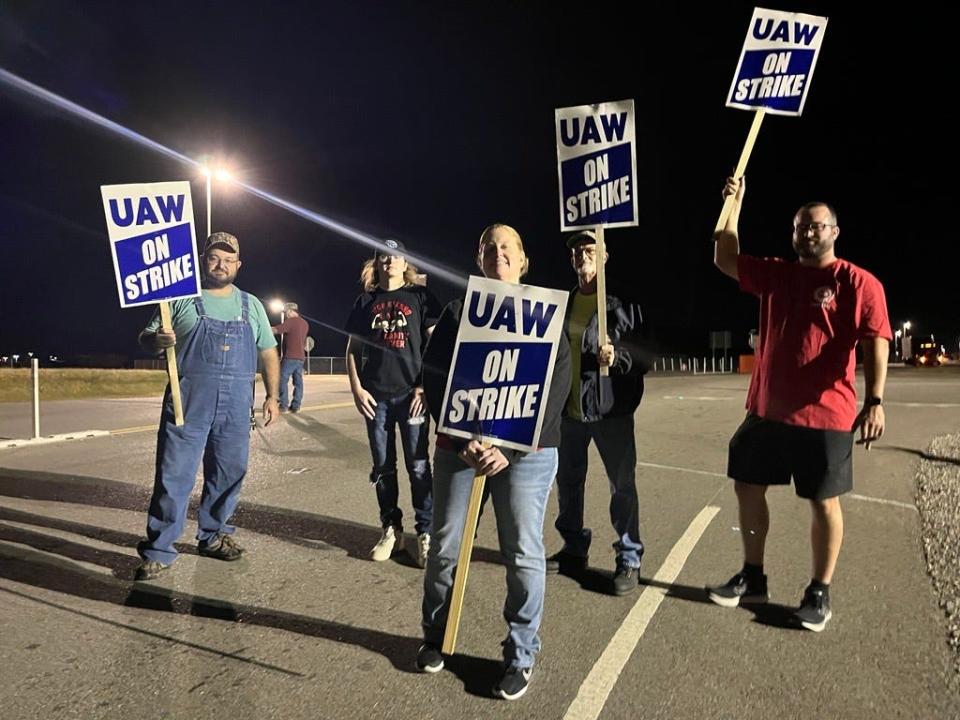 Picketers gather at the North Gate of the Spring Hill GM plant as a strike revs up after being announced at 5 p.m. Saturday night. From left are Joe Haynes, Brent Menaugh, Amy Anglum, Brad Worland and Chris Wood.