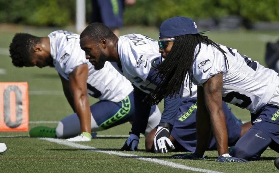 Will Seahawks cornerback Richard Sherman, right, strong safety Kam Chancellor, center, and free safety Earl Thomas, left, still be playing together in 2018?