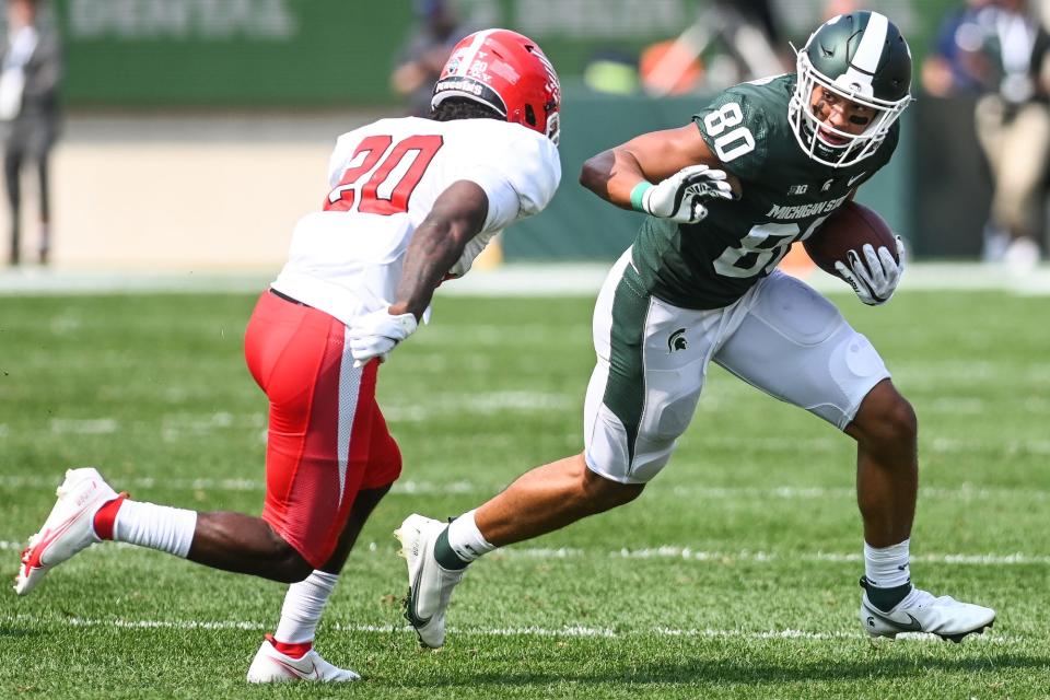 Michigan State's Ian Stewart, right, catches a pass as Youngstown State's Natavious Payne closes in during the fourth quarter on Saturday, Sept. 11, 2021, at Spartan Stadium in East Lansing.