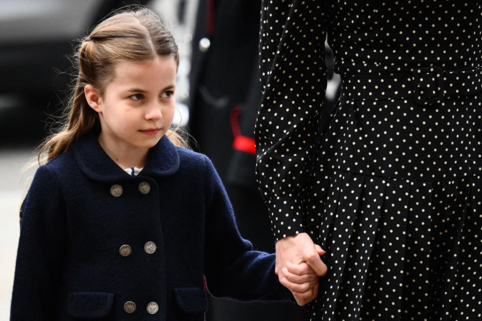 Princess Charlotte arrived at the event holding her mother, the Duchess of Cambridge's hand.(Photo by DANIEL LEAL/AFP via Getty Images)