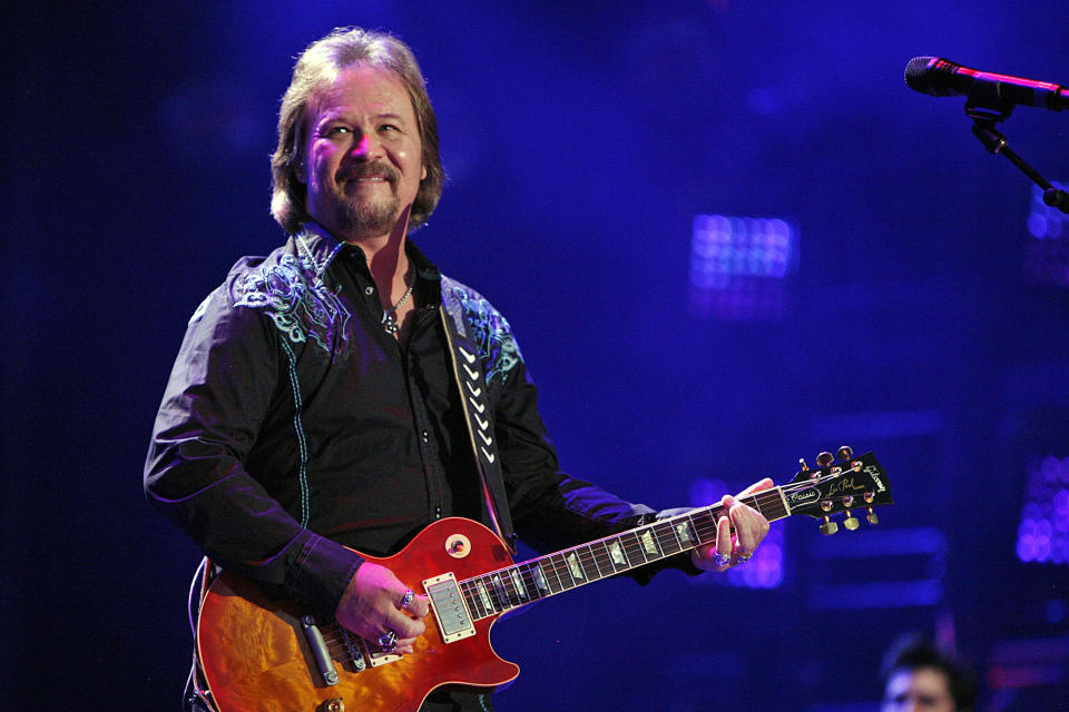 FILE - In this Friday, June 6, 2014 file photo, Travis Tritt performs during the CMA Fest at LP Field in Nashville, Tenn. Tritt, who canceled shows at venues that required a COVID-19 vaccine or mask-wearing, was set to sing the national anthem before Game 6 of the NL Championship Series on Saturday night, Oct. 23, 2021. The Braves' 41,000-seat stadium, Truist Park, has allowed full capacity most of the season with no requirements for vaccinations, negative tests or mask-wearing from fans. (Photo by Wade Payne/Invision/AP, File)