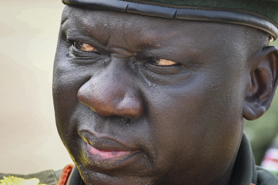 Deputy Chief of Defense Forces Lt. Gen. Thoi Chany Reat attends a ceremony for soldiers from the South Sudan People's Defence Forces (SSPDF) preparing to join the East Africa Community Regional Force (EACRF) in Congo, at the airport in Juba, South Sudan Monday, April 3, 2023. A United Nations-backed panel of investigators alleges in a new report that several officials in South Sudan including Reat have perpetrated serious human rights violations and should be held accountable for their crimes. (AP Photo/Samir Bol)