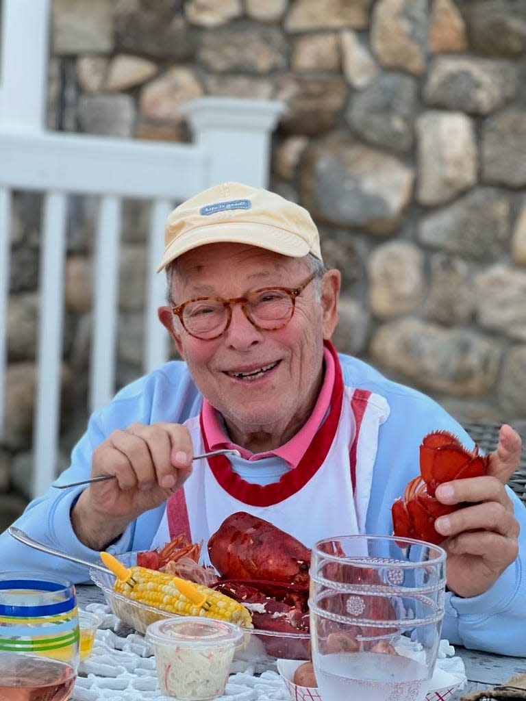 David Madison, former mayor of Bexley, enjoys lobster with family in his later years in this hand-out photo of his family.  Madison died Saturday, June 1, 2024 at the age of 92.